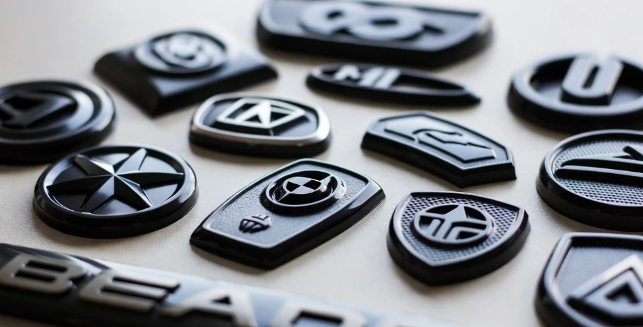 Custom plastic emblems and plastic decorative nameplates by King Epoxy Emblem Co., Ltd for product branding and identification